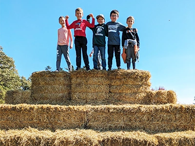 Kids on hay bails