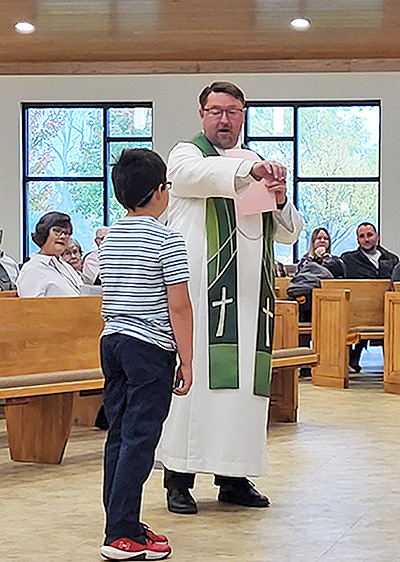 pastor quizzing student