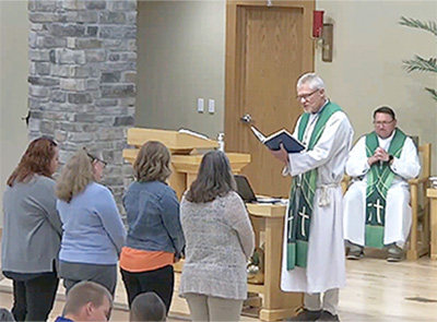 pastor giving mass